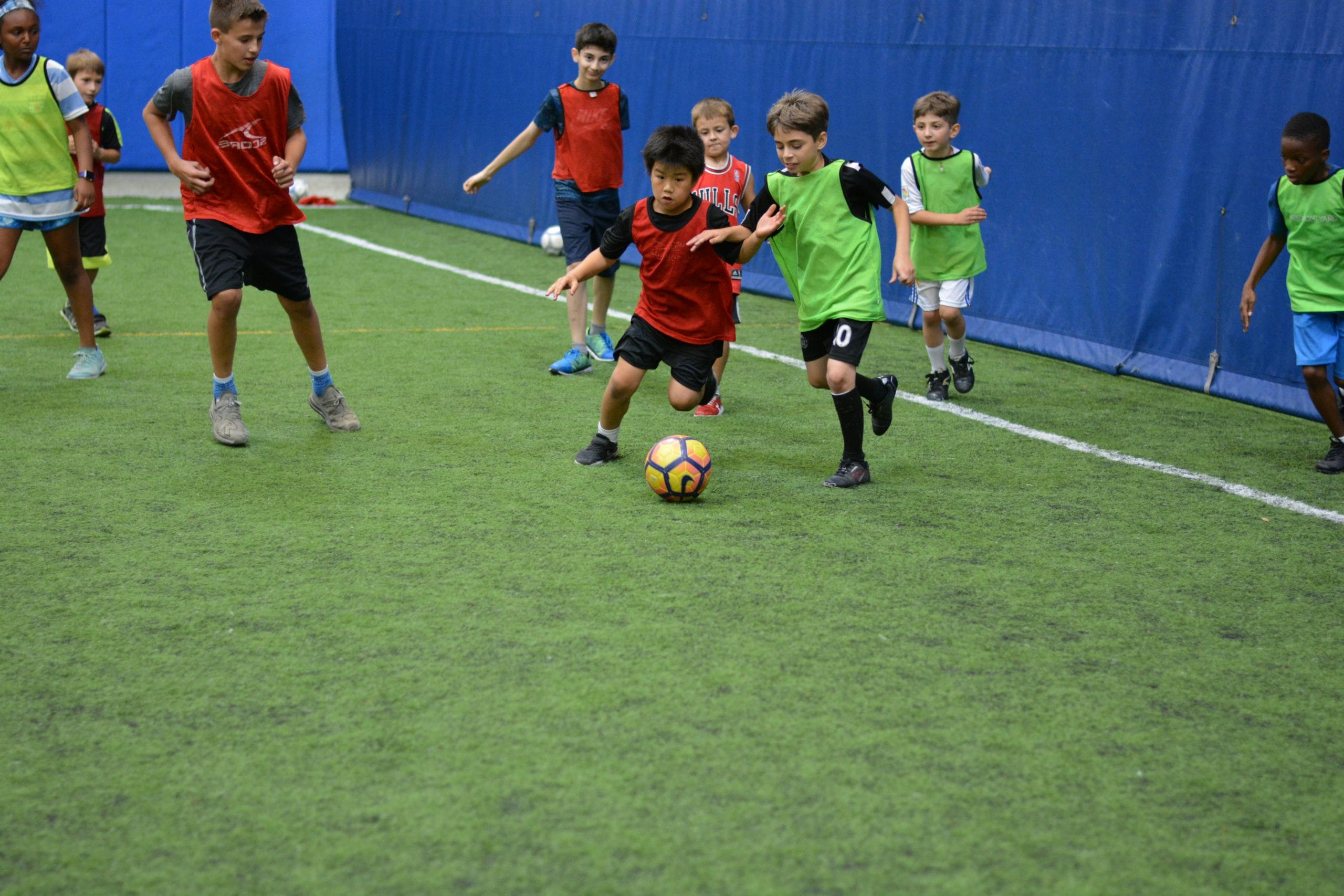 Youth indoor soccer league game on turf field at Milwaukee Yard in Oak Creek WI