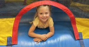 Kids playing in large inflatables at fun camp at Milwaukee Yard Oak Creek