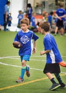 Youth football skills and speed training for ages 8 to 11 on indoor turf at Milwaukee Yard in Oak Creek WI