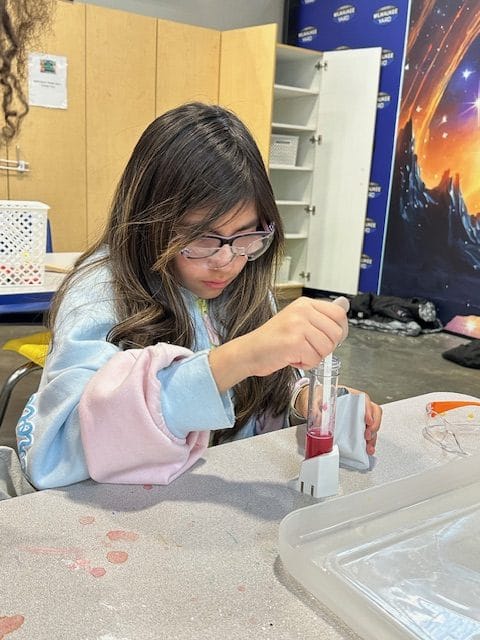 Summer FUN Camp child doing science experiment at Milwaukee Yard Oak Creek WI