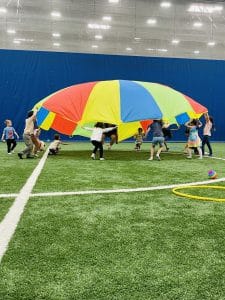 Kids playing with parachute at Milwaukee Yard Oak Creek WI