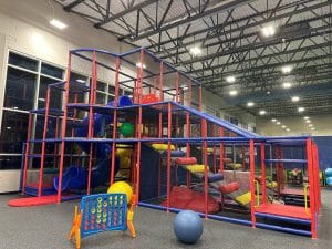 Kids climbing 5 level play tower during birthday party at Milwaukee Yard in Oak Creek WI