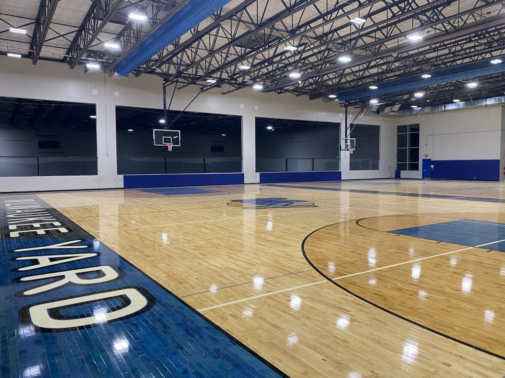 12,000 square foot court area that is lined for 2 regulation basketball courts, 3 regulation volleyball courts, or 6 regulation pickleball courts at Milwaukee Yard Oak Creek WI