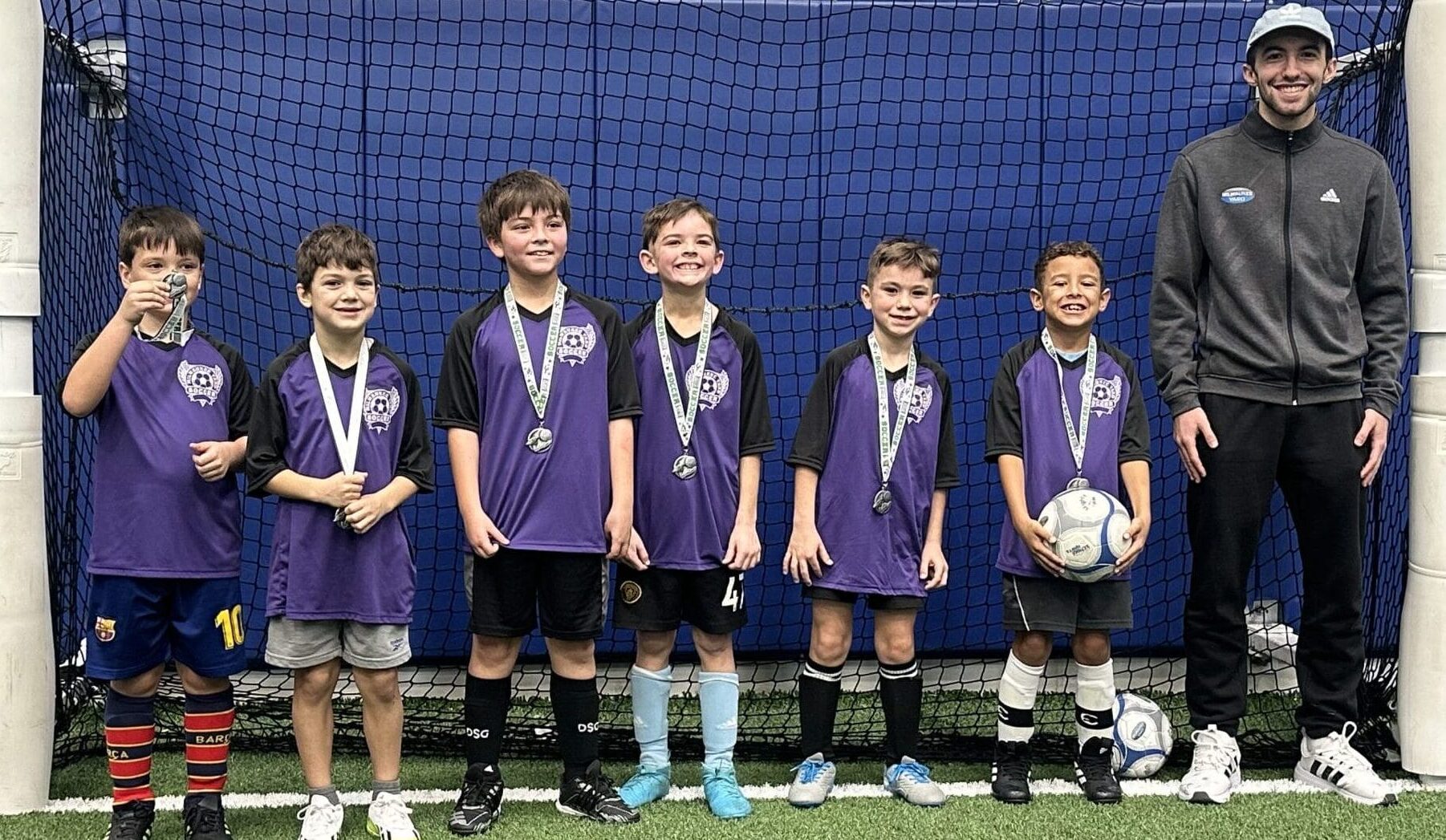 Youth indoor soccer league winners on turf field at Milwaukee Yard in Oak Creek WI