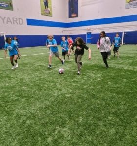 Children playing organized sports during summer FUN Camp at Milwaukee Yard in Oak Creek WI
