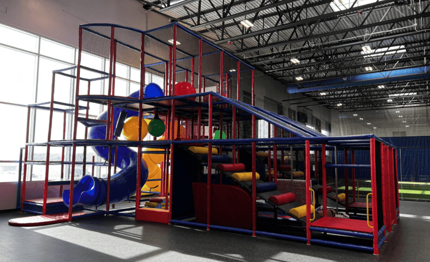 ids climbing 5 level play tower during birthday party at Milwaukee Yard in Oak Creek WI