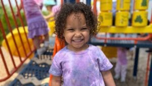 Child playing on outside playground during FUN Camp at Milwaukee Yard Oak Creek WI