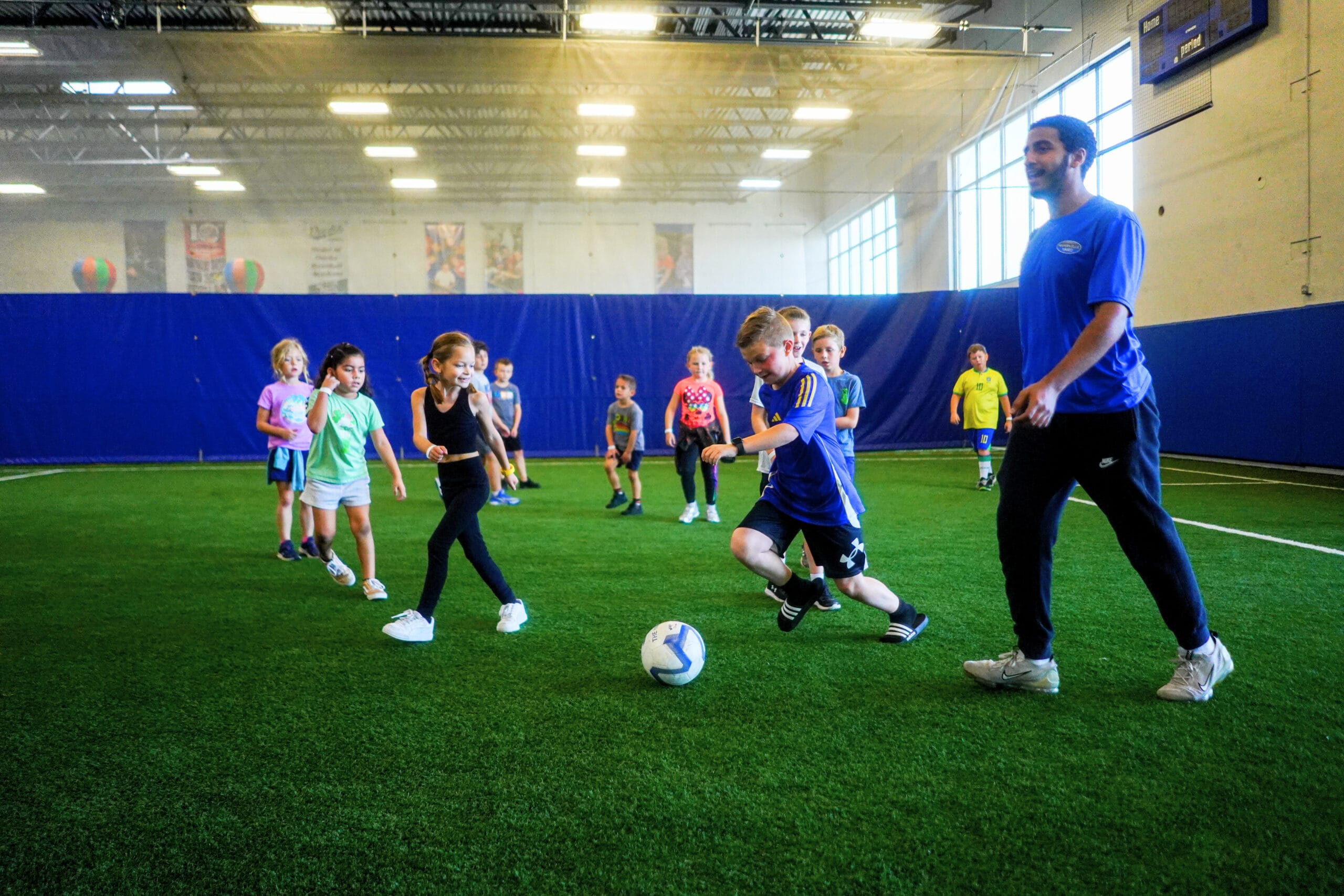 Field birthday party playing soccer at the yard